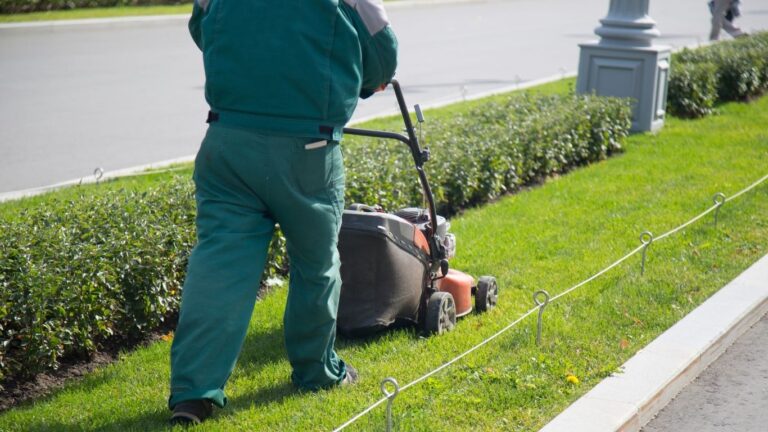 man mowing small area of grass